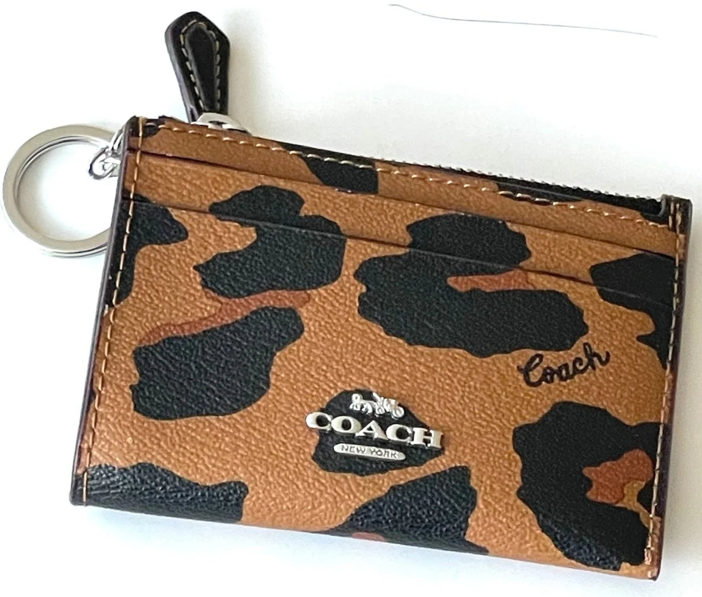 Coach tarjetero con cierre animal print