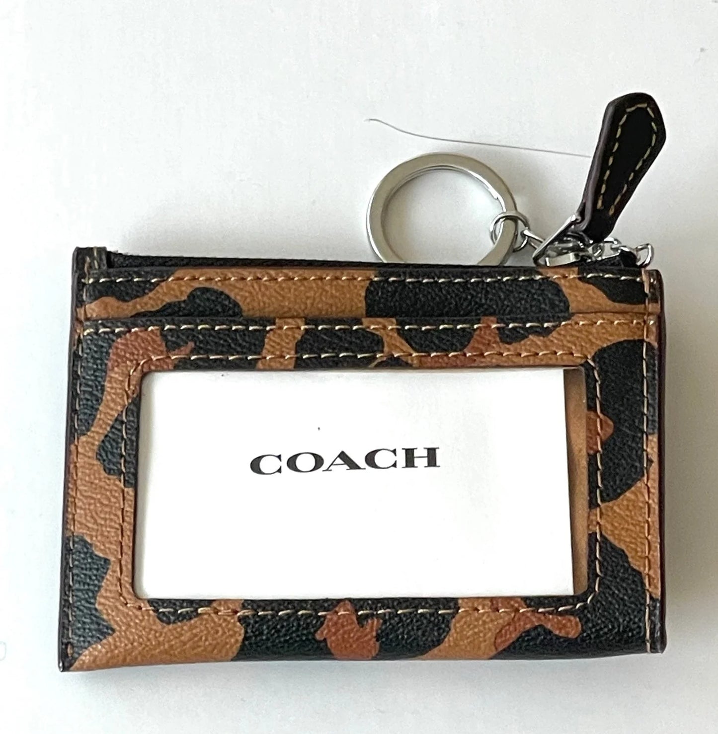 Coach tarjetero con cierre animal print