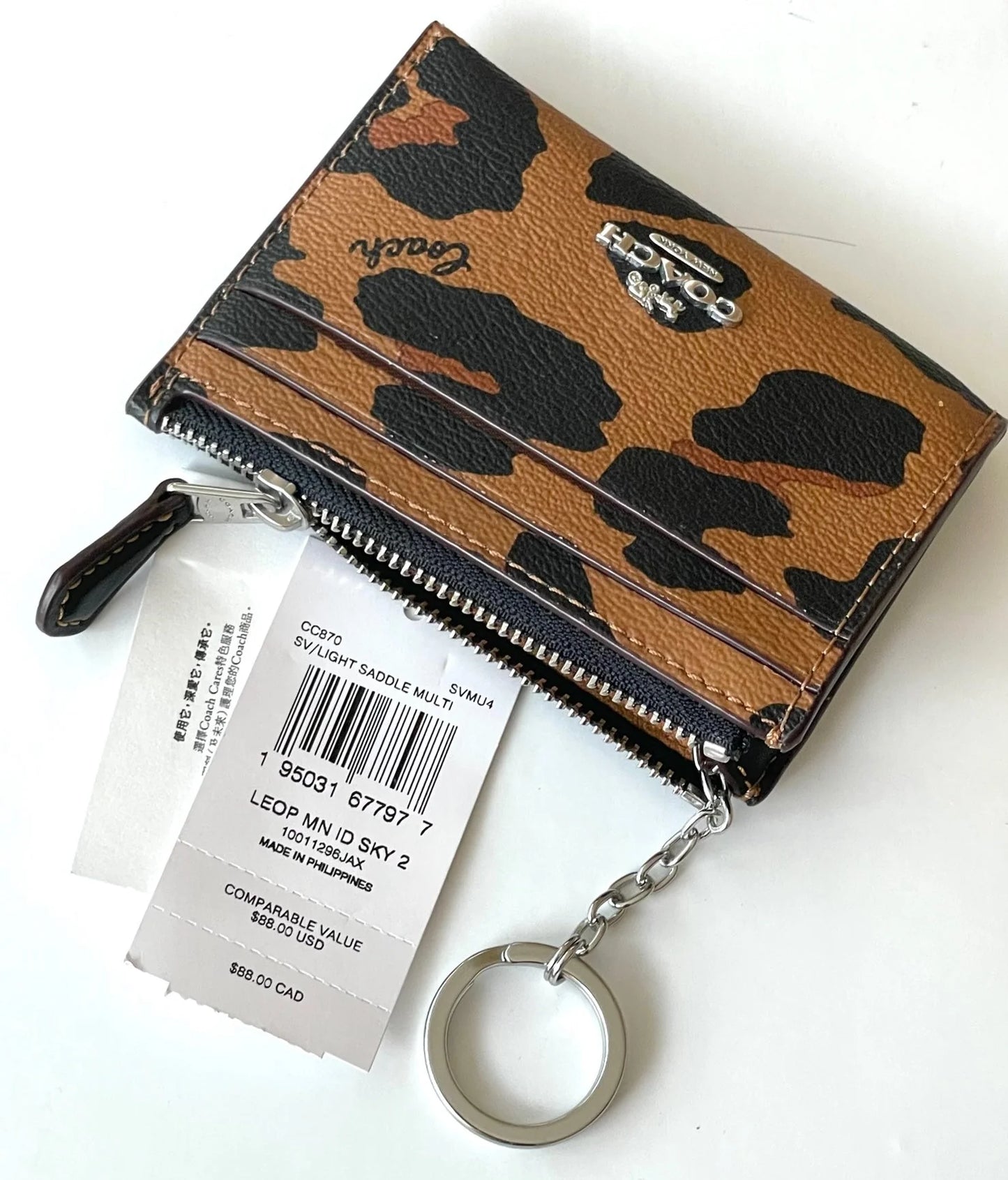 Coach tarjetero con cierre animal print