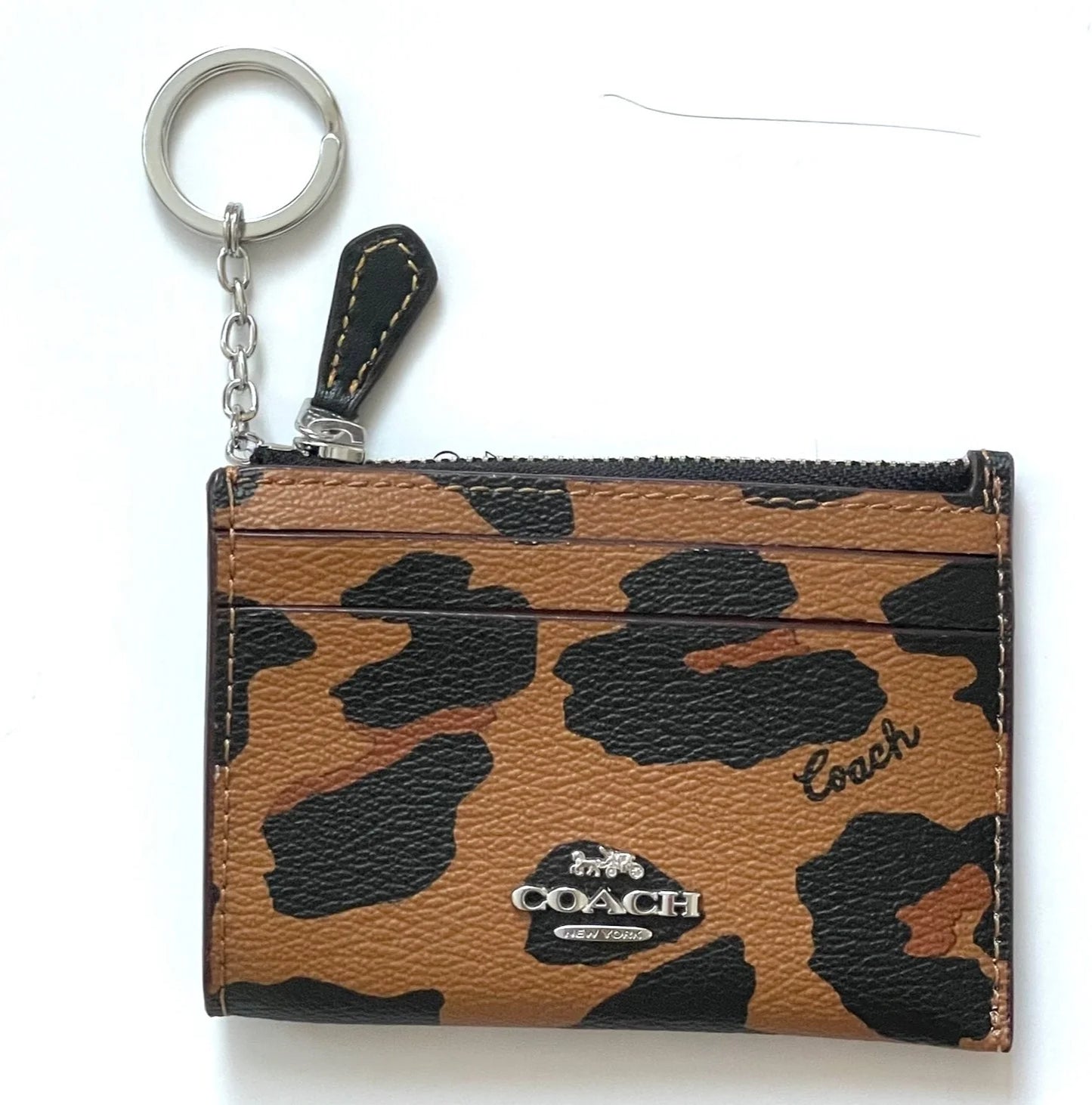 Coach tarjetero con cierre animal print