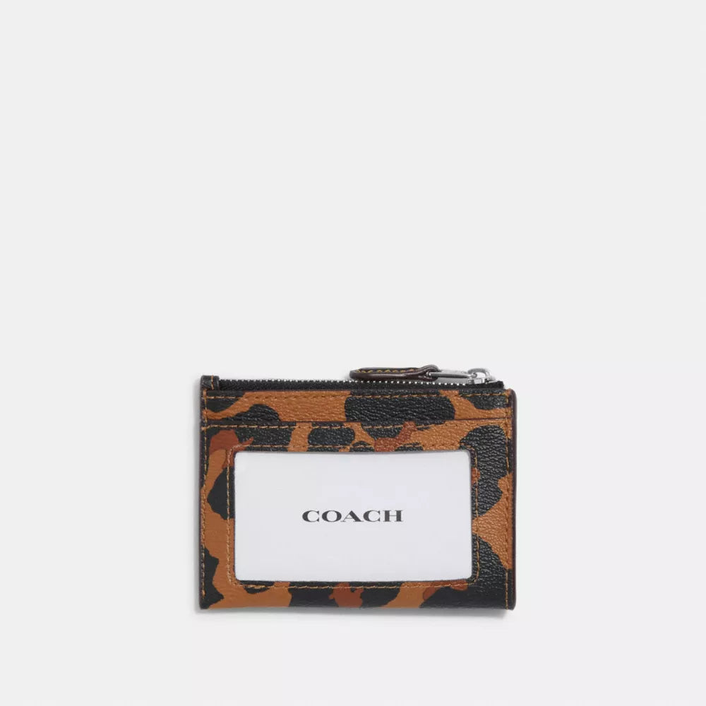 Coach tarjetero con cierre animal print