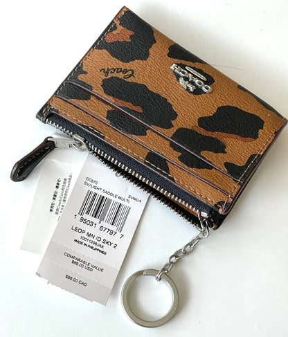 Coach tarjetero con cierre animal print