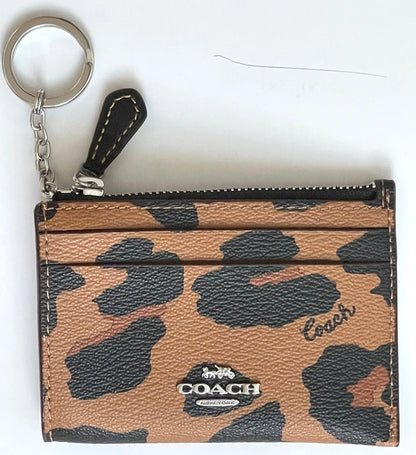 Coach tarjetero con cierre animal print