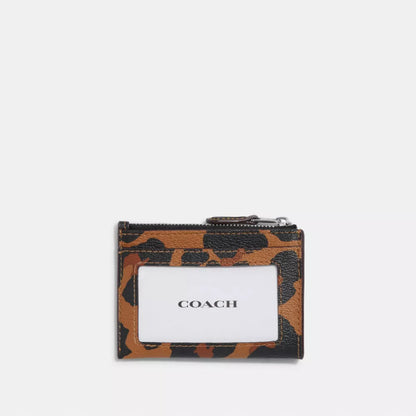 Coach tarjetero con cierre animal print